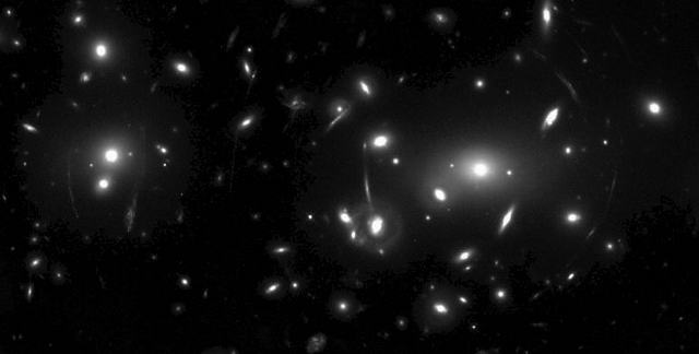 NASA Hubble Space Telescope image of the rich galaxy cluster  Abell 2218 taken in April of 1995. Credits:  W.Couch (University of New South Wales), R. Ellis (Cambridge University), and NASA.